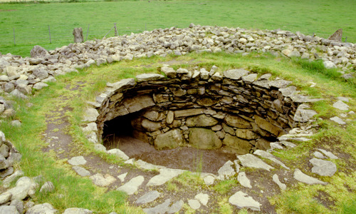 The round, now uncovered Corrimony cairn seen from above, with a passage leading outside the cairn visible