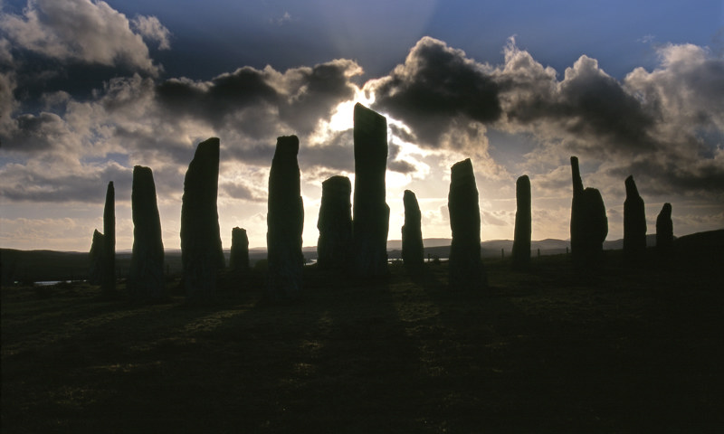 The sun setting behind the standing stones at Calanais.