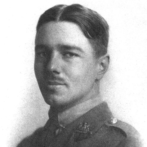 Black and white portrait photo of a person with a moustache in military uniform.