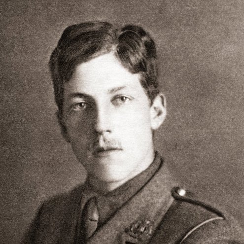A person with a small moustache and wearing a soldier