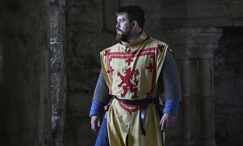 A Living History performer is dressed up as Robert the Bruce.
