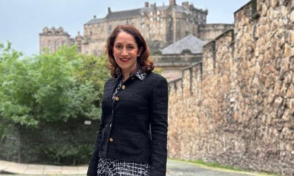 Portrait of Katerina Brown, pictured in front of the Flodden Wall, with Edinburgh Castle in the background.