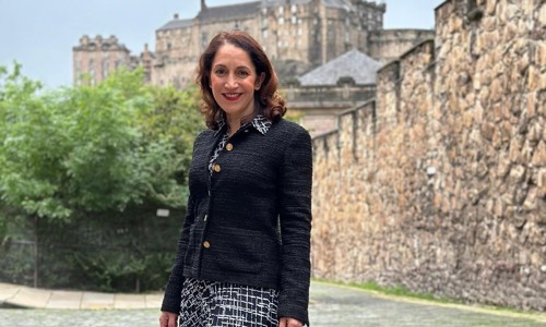 Portrait of Katerina Brown, pictured in front of the Flodden Wall, with Edinburgh Castle in the background.